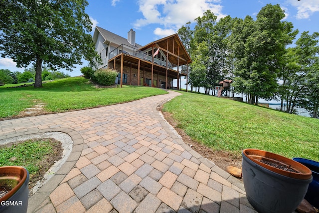 3995 Island View Way, Sevierville, TN 37876 - view of front of house featuring a front yard, a deck, and a chimney