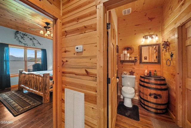 3995 Island View Way, Sevierville, TN 37876 - bathroom featuring wood finished floors, wooden walls, and a ceiling fan