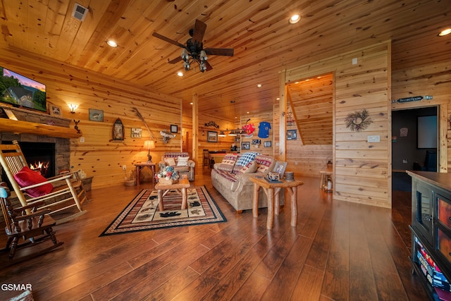 3995 Island View Way, Sevierville, TN 37876 - living room featuring a fireplace, wooden walls, ceiling fan, hardwood / wood-style flooring, and wooden ceiling