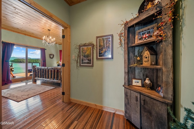 3995 Island View Way, Sevierville, TN 37876 - hall featuring wooden ceiling, a chandelier, wood finished floors, and a water view