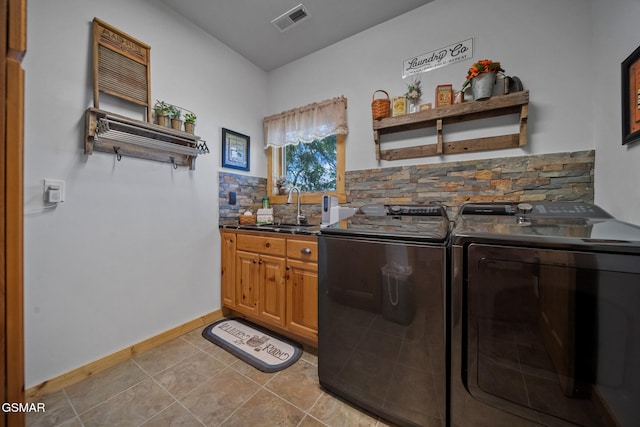 3995 Island View Way, Sevierville, TN 37876 - washroom with independent washer and dryer, cabinet space, and light tile patterned floors