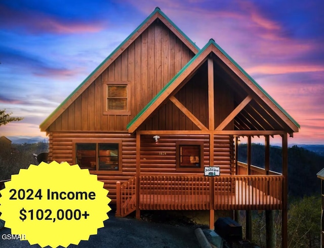 cabin featuring board and batten siding