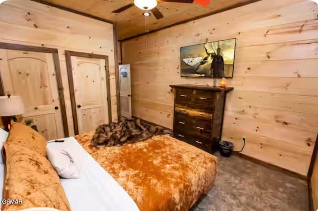 bedroom with concrete flooring and wooden walls