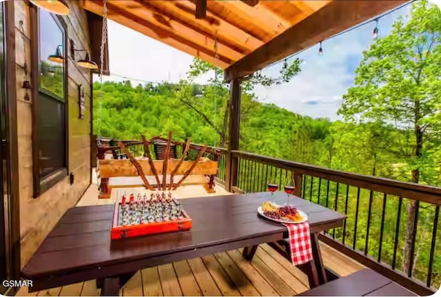 deck with outdoor dining space