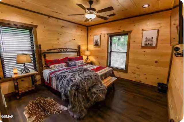 bedroom featuring wooden walls and wood finished floors