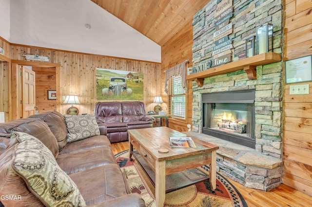 269 Cherokee Path Way, Sevierville, TN 37876 - living area featuring a stone fireplace, wood finished floors, and wooden walls