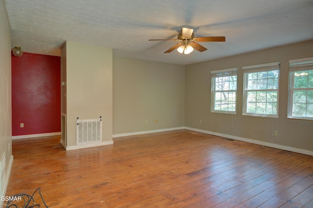 1940 Big Chiefs Skyview Dr, Sevierville, TN 37876 - unfurnished room featuring hardwood / wood-style floors, ceiling fan, baseboards, and visible vents