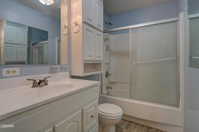 1940 Big Chiefs Skyview Dr, Sevierville, TN 37876 - bathroom featuring toilet, a textured ceiling, enclosed tub / shower combo, and vanity