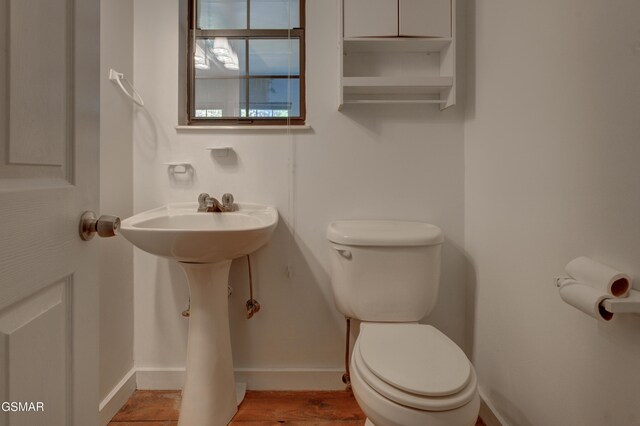 1940 Big Chiefs Skyview Dr, Sevierville, TN 37876 - half bathroom featuring baseboards, toilet, and wood finished floors