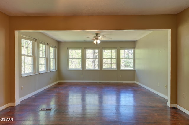 1940 Big Chiefs Skyview Dr, Sevierville, TN 37876 - unfurnished room featuring dark wood-style floors, baseboards, visible vents, and ceiling fan