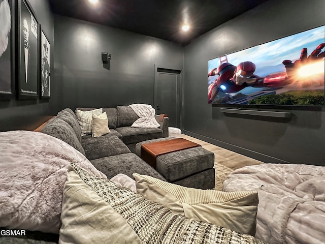 home theater featuring recessed lighting, baseboards, and wood finished floors