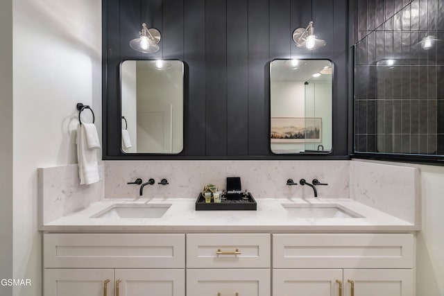 full bath featuring double vanity and a sink