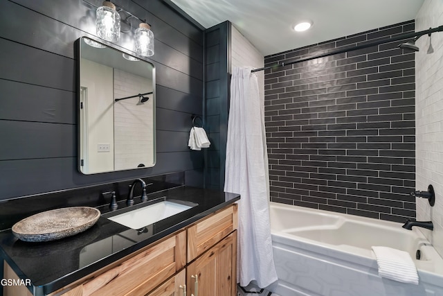 bathroom with shower / tub combo and vanity