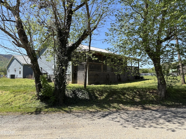 147 Padgett Mill Rd, Cosby, TN 37722 - view of side of home with a yard, central air condition unit, and a deck