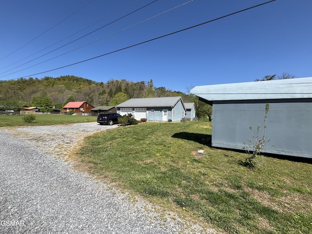 147 Padgett Mill Rd, Cosby, TN 37722 - exterior space with an attached garage, a lawn, and driveway