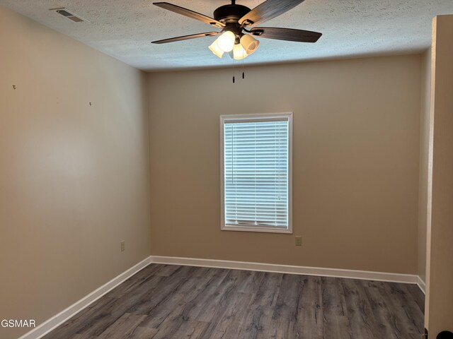 147 Padgett Mill Rd, Cosby, TN 37722 - spare room with wood finished floors, a textured ceiling, ceiling fan, baseboards, and visible vents