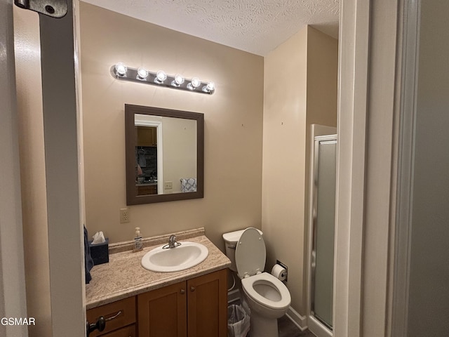 147 Padgett Mill Rd, Cosby, TN 37722 - bathroom with a shower stall, toilet, vanity, and a textured ceiling