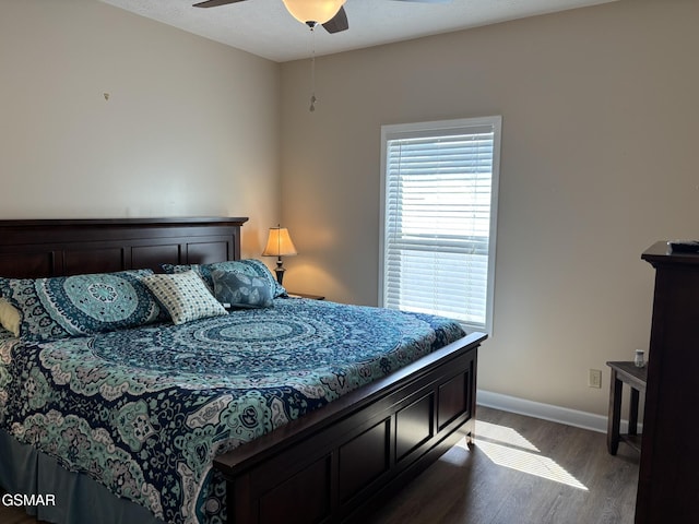 147 Padgett Mill Rd, Cosby, TN 37722 - bedroom with dark wood finished floors, a ceiling fan, and baseboards