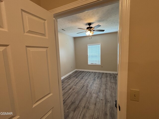 147 Padgett Mill Rd, Cosby, TN 37722 - unfurnished room with wood finished floors, visible vents, a ceiling fan, baseboards, and a textured ceiling