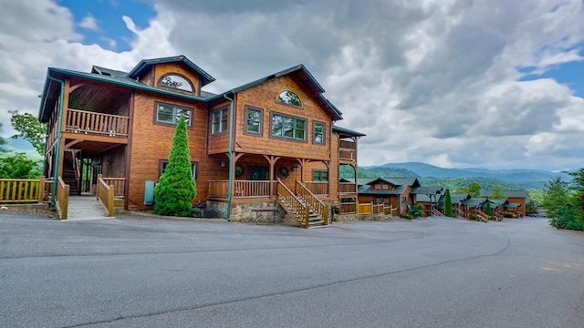 view of front of house featuring a mountain view and covered porch