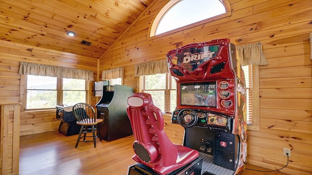 playroom with hardwood / wood-style floors, vaulted ceiling, wood walls, and wood ceiling