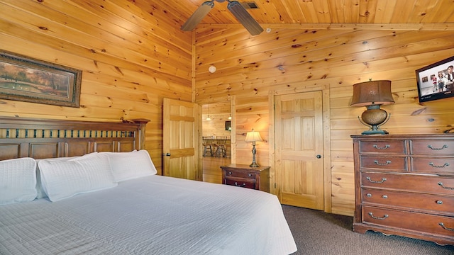 bedroom with dark colored carpet, lofted ceiling, ceiling fan, and wood ceiling