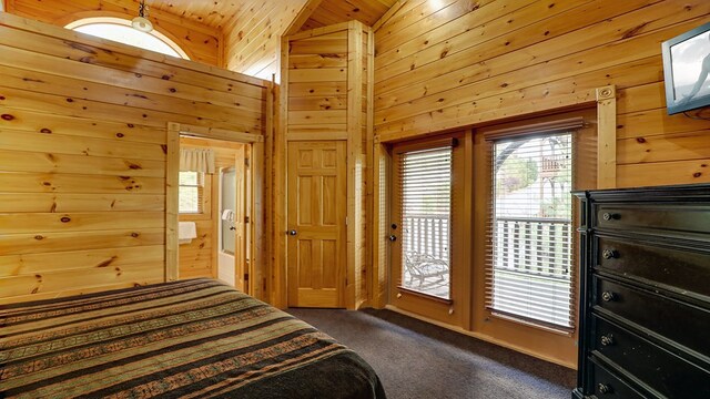 bedroom with wooden ceiling, dark colored carpet, high vaulted ceiling, access to outside, and wooden walls