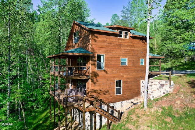 view of property exterior with a balcony