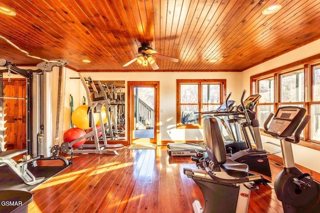 workout area with ceiling fan, hardwood / wood-style floors, and ornamental molding