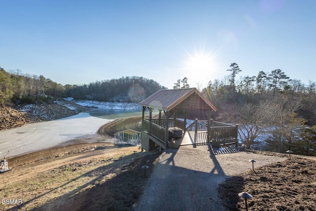 view of dock featuring a water view and a gazebo