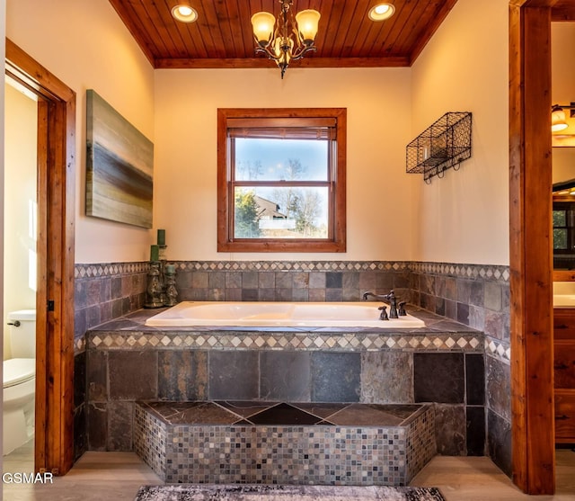 bathroom featuring toilet, tile walls, tiled bath, and wood ceiling