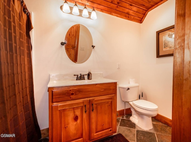 bathroom featuring vanity, toilet, wooden ceiling, and lofted ceiling