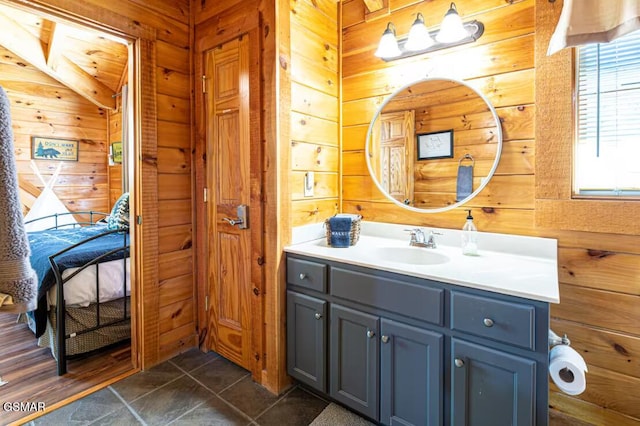 2430 Cobbler Way, Pigeon Forge, TN 37863 - bathroom featuring wood walls, vanity, and tile patterned floors