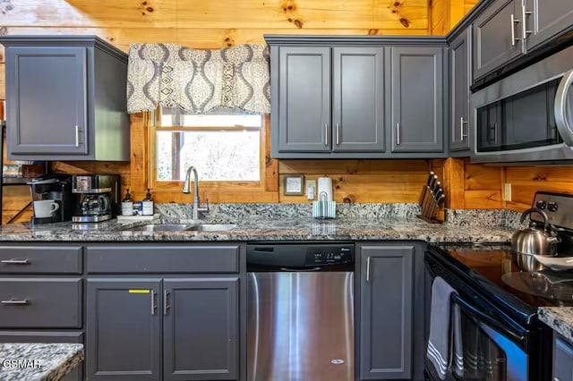 2430 Cobbler Way, Pigeon Forge, TN 37863 - kitchen with appliances with stainless steel finishes, gray cabinetry, and stone counters