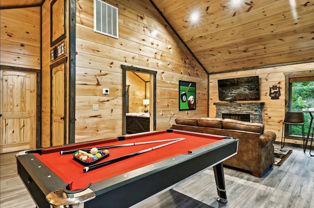 game room featuring wood ceiling, wooden walls, and pool table