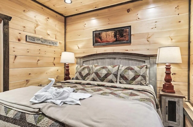 bedroom with wood ceiling and wooden walls