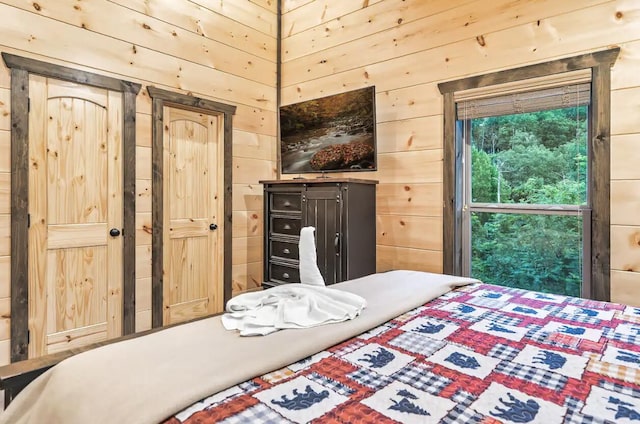 bedroom with wooden walls