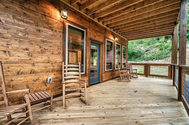 wooden deck featuring covered porch