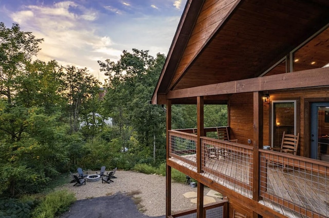 property exterior at dusk with an outdoor fire pit