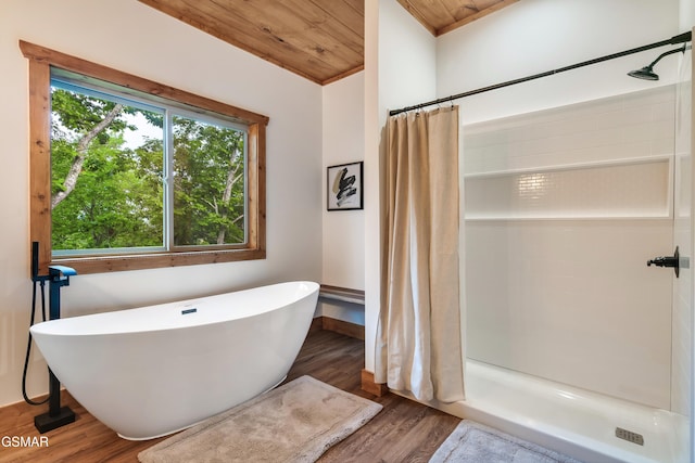 2278 Headrick Lead, Sevierville, TN 37862 - full bath featuring wooden ceiling, wood finished floors, curtained shower, and a soaking tub