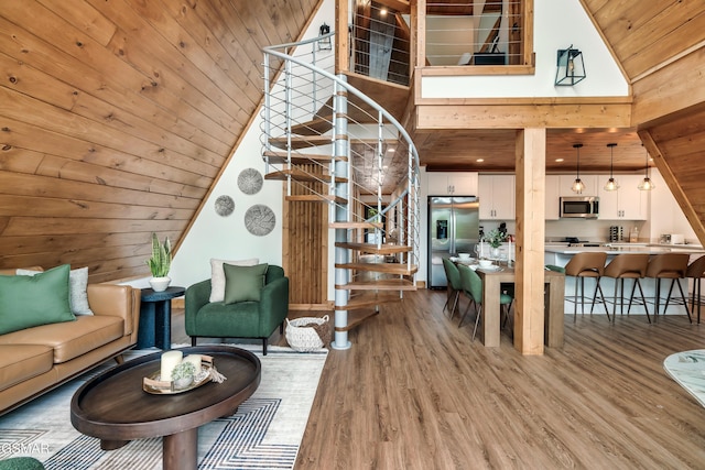 2278 Headrick Lead, Sevierville, TN 37862 - living area featuring stairs, wood ceiling, light wood finished floors, and high vaulted ceiling