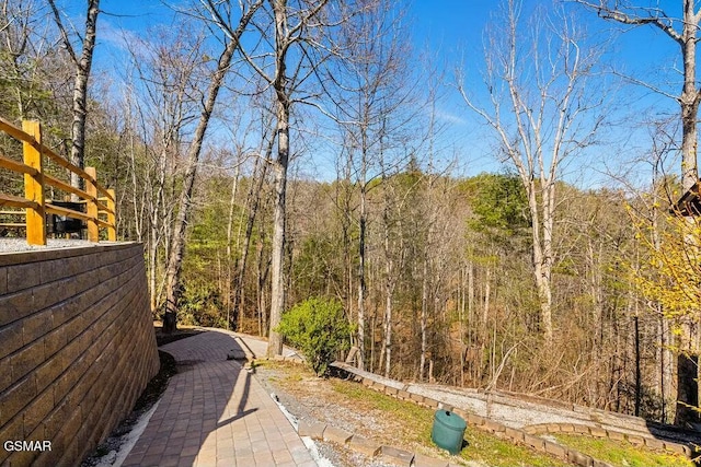 view of yard featuring a view of trees