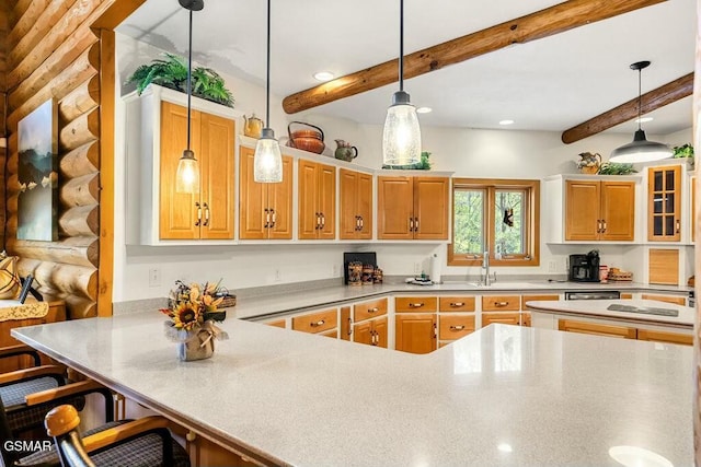 kitchen with pendant lighting, beam ceiling, a peninsula, a kitchen breakfast bar, and a sink