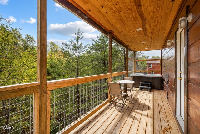 deck with a hot tub