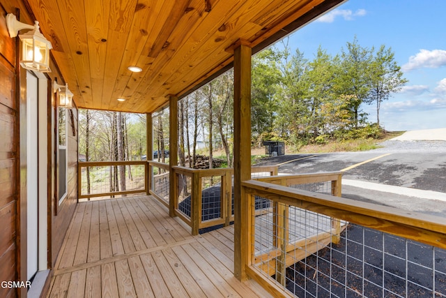 unfurnished sunroom with wooden ceiling