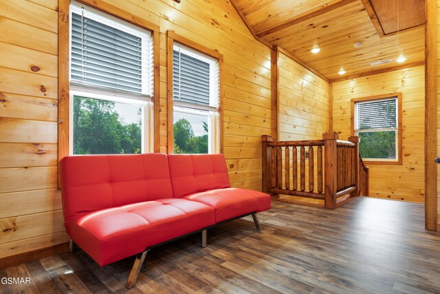 sitting room featuring wood walls, wooden ceiling, dark wood-type flooring, and vaulted ceiling