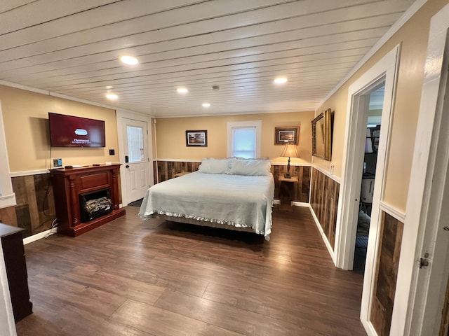 bedroom with dark hardwood / wood-style flooring, wooden ceiling, and wooden walls