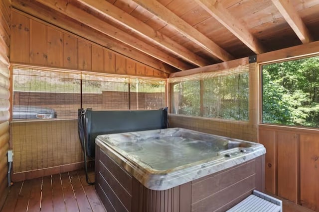 wooden terrace with a hot tub