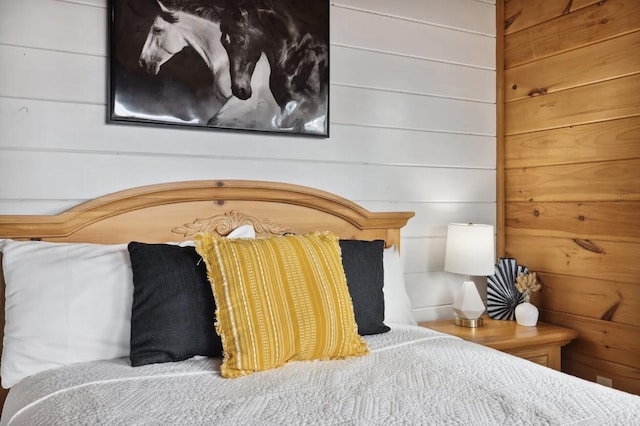 bedroom with wood walls