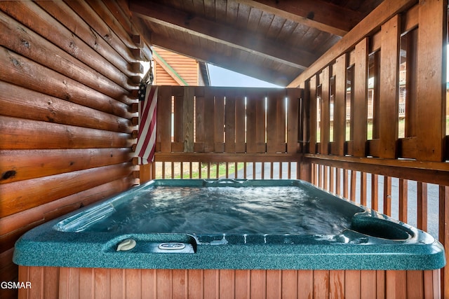 deck featuring a hot tub